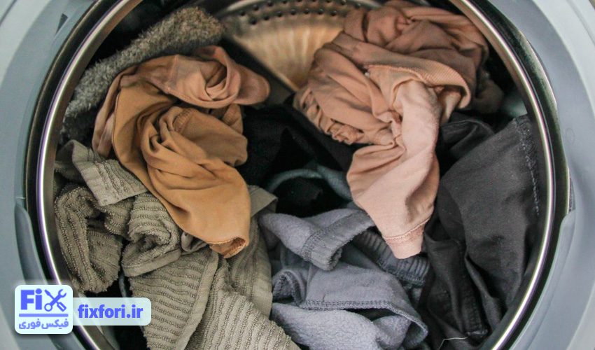 پر کردن بیش از حد دیگ علت لرزش ماشین لباسشویی کندی